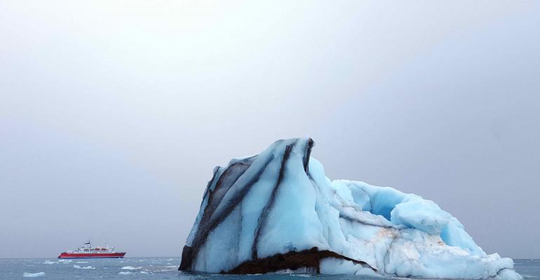 Arctic iceberg and expedition ship.jpg