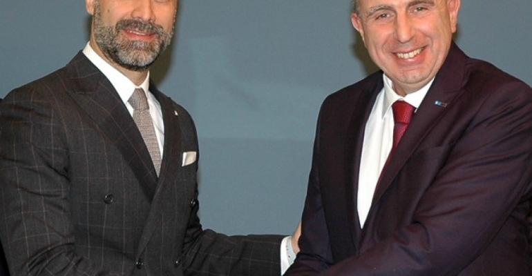 Mario Zanetti, president of Costa Group Asia, left, is congratulated by Fincantieri's Roberto Olivari, director of Monfalcone shipyard
