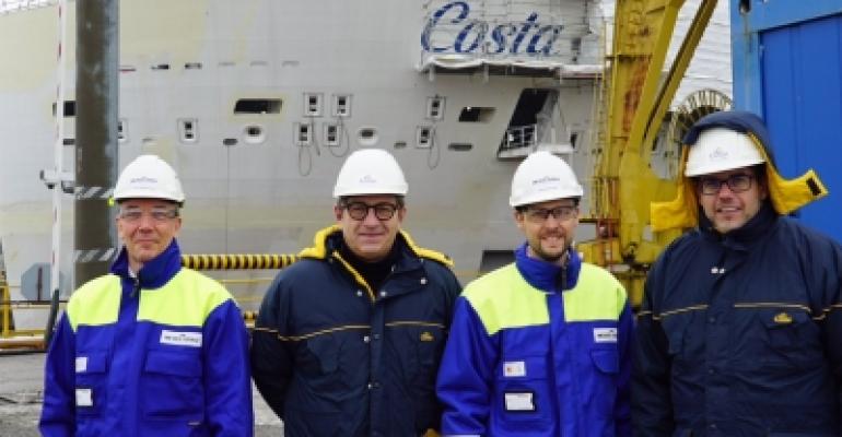 Costa president Neil Palomba, far right, visits Meyer Turku ahead of the float-out
